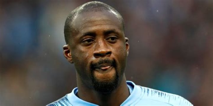 Which manager bought Yaya Toure to Barcelona?