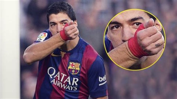Why do soccer players kiss their wrists?